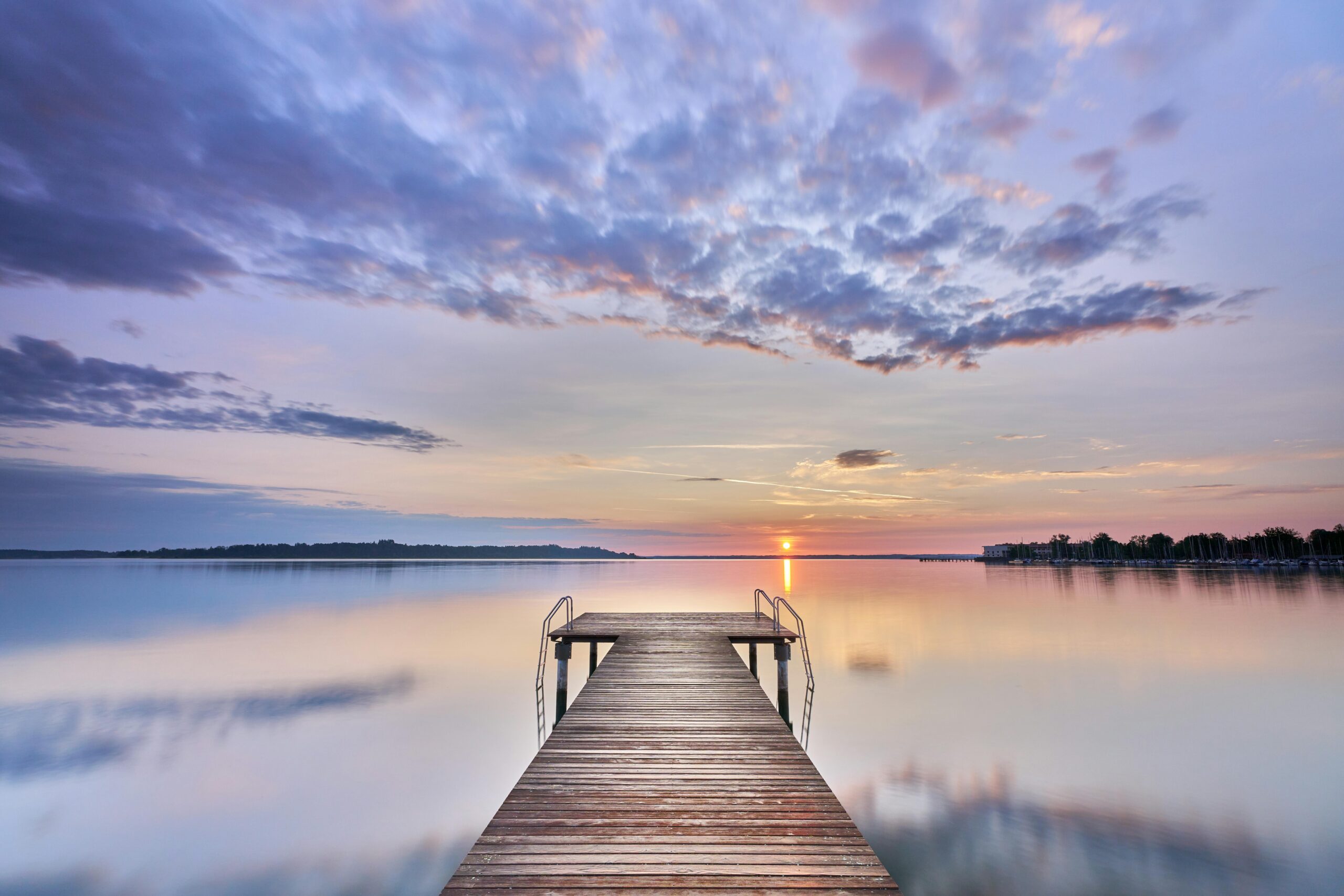 A Michigan dock and lake at sunset, part of the landscape of the Michiana area that CirclePoint Financial Advisors serve